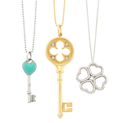 Lot 172 - Three Gold, Silver, Diamond and Enamel Key and Clover Pendants with Chains, Tiffany & Co.