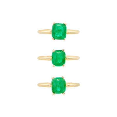Lot 317 - Three Gold and Cabochon Emerald Rings