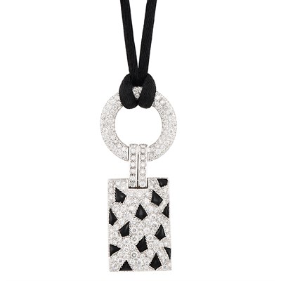 Lot 213 - White Gold, Diamond and Black Onyx 'Panthere' Pendant with Satin Cord, Cartier, France