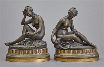 Lot 559 - Pair of Gilt and Patinated-Bronze Figures of...