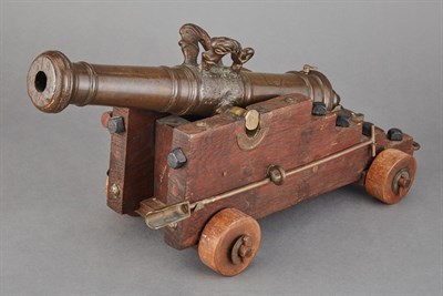 Lot 485 - Miniature Bronze Cannon on a Wood Chassis...