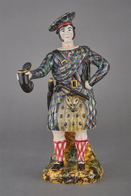 Lot 541 - Staffordshire Figure of a Scottish Highlander...