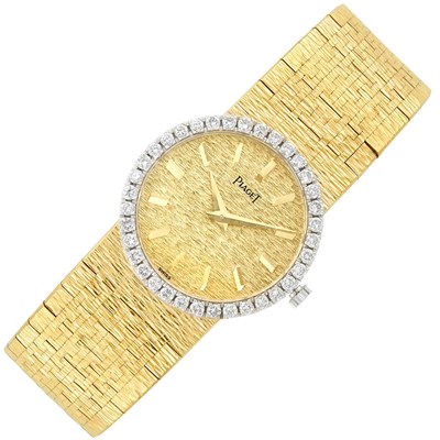 Lot 325 - Lady's Two-Color Gold and Diamond Wristwatch, Piaget