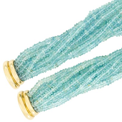 Lot 38 - Pair of Multistrand Aquamarine Bead and Gold Torsade Bracelets, Verdura