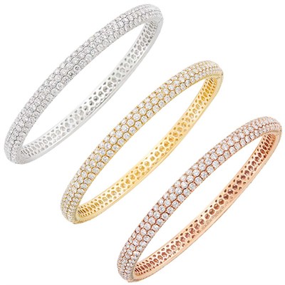 Lot 252 - Three Yellow, White, Rose Gold and Diamond Bangle Bracelets