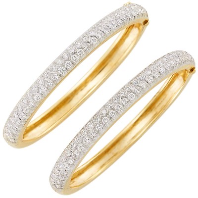 Lot 200 - Pair of Two-Color Gold and Diamond Bangle Bracelets