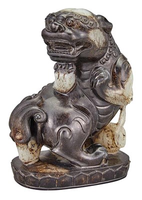 Lot 85 - Chinese Black and White Jade Qilin Modeled...