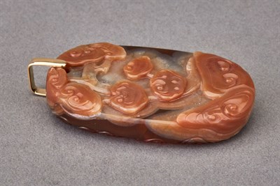 Lot 192 - Chinese Agate Pendant The oval form carved in...