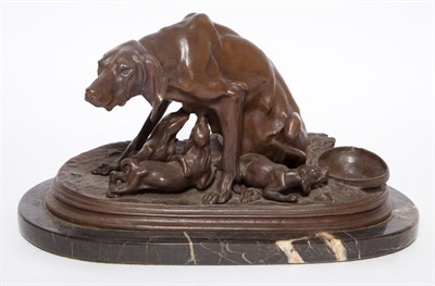 Lot 547 - Bronze Group of a Seated Hound Nursing Her...