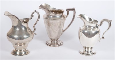 Lot 409 - Three American Sterling Silver Water Pitchers...