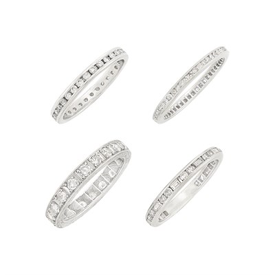 Lot 129 - Four Platinum and Diamond Band Rings