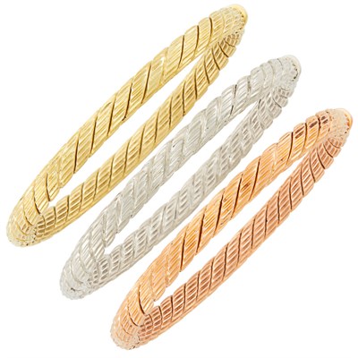 Lot 565 - Three Yellow, White and Rose Gold Bangle Bracelets