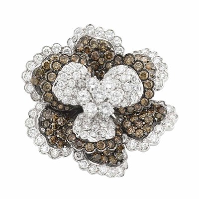 Lot 570 - White and Blackened Gold, Diamond and Brown Diamond Flower Clip-Brooch