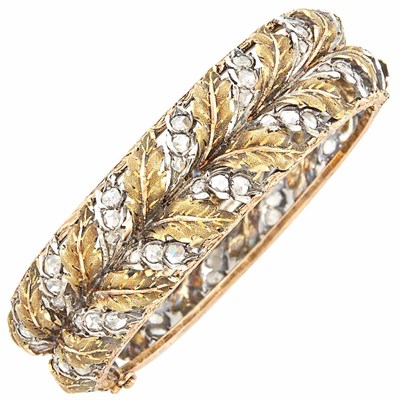 Lot 390 - Two-Color Gold, Silver and Diamond Bangle Bracelet