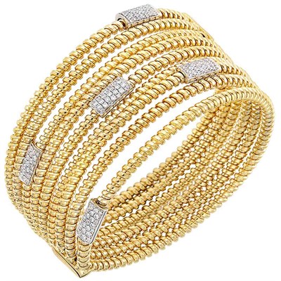 Lot 399 - Two-Color Gold and Diamond Bangle Bracelet