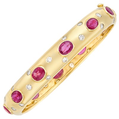 Lot 316 - Gold, Ruby and Diamond Bangle Bracelet
