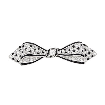 Lot 105 - Platinum, Diamond and Black Onyx Bow Pin