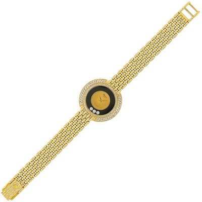 Lot 449 - Gold, Diamond and Black Onyx 'Happy Diamonds' Wristwatch, Chopard