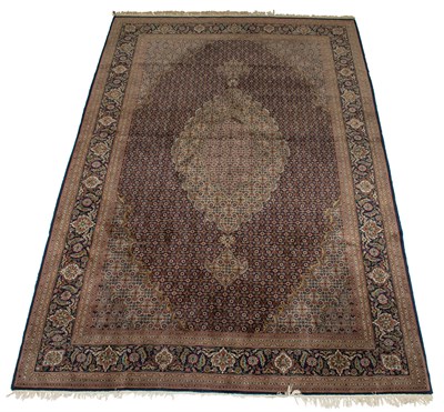 Lot 571 - Kurk Wool and Silk Mahi Tabriz Carpet...