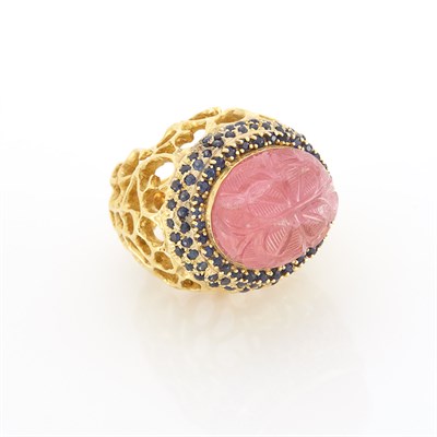 Lot 1556 - Gold, Carved Pink Tourmaline and Sapphire Dome Ring