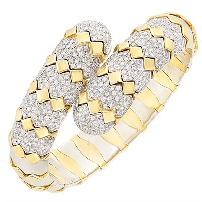 Lot 115 - Two-Color Gold and Diamond Crossover Bangle Bracelet