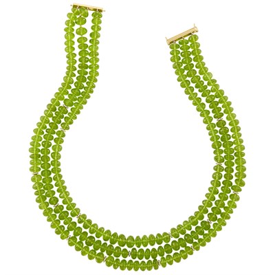 Lot 211 - Triple Strand Peridot Bead, Gold and Diamond Necklace