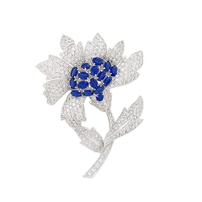 Lot 259 - Platinum, Sapphire and Diamond Flower Clip-Brooch