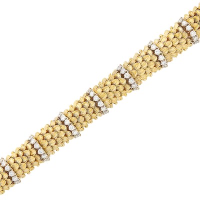 Lot 638 - Two-Color Gold and Diamond Bombé Bracelet