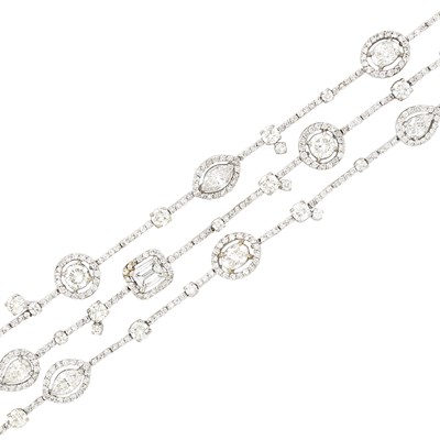 Lot 277 - Triple Strand White Gold and Diamond Bracelet