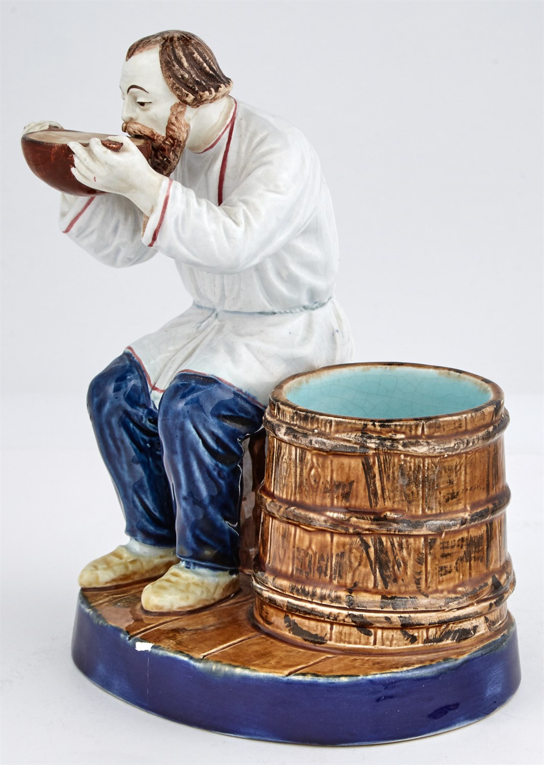 Lot 123 - Russian Glazed Pottery Figure of a Peasant...