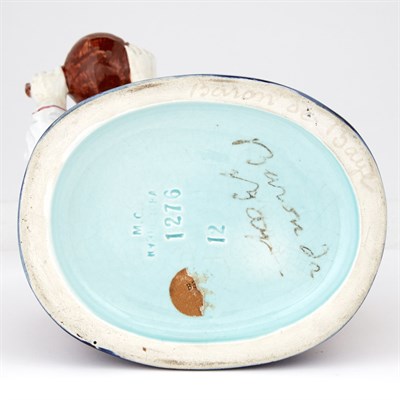 Lot 123 - Russian Glazed Pottery Figure of a Peasant...