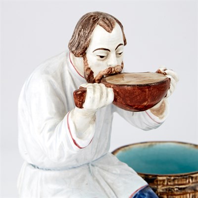 Lot 123 - Russian Glazed Pottery Figure of a Peasant...