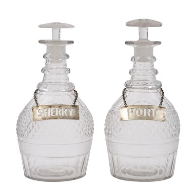 Lot 252 - Two Similar Molded and Cut Glass Decanters...