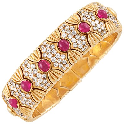Lot 642 - Gold, Cabochon Ruby and Diamond Bangle Bracelet
