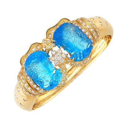 Lot 499 - Gold, Carved Blue Glass and Diamond Bangle Bracelet