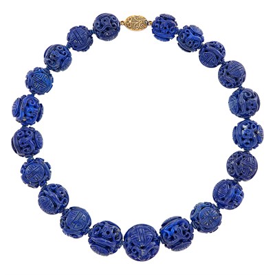 Lot 28 - Carved Lapis Bead Necklace with Silver-Gilt Clasp