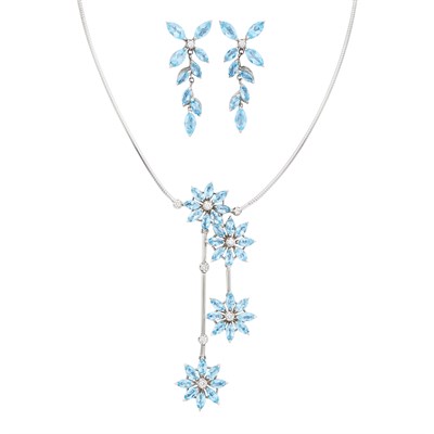 Lot 596 - White Gold, Blue Topaz and Diamond 'Daisy' Pendant-Necklace and Pair of Pendant-Earrings, Asprey