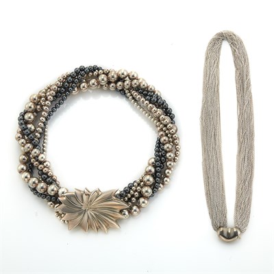 Lot 1111 - Multistrand Silver 'Bean' Necklace, Tiffany & Co., Elsa Peretti, and Six Strand Silver and Hematite Bead Necklace