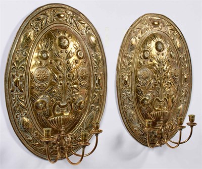 Lot 369 - Pair of Brass Repoussé Three-Light Wall Lights...