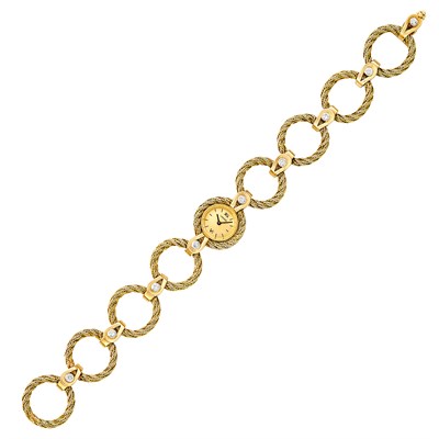 Lot 64 - Gold and Diamond Wristwatch, Cartier, France, Movado