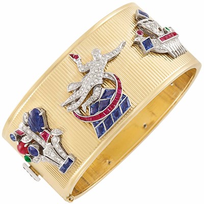 Lot 217 - Gold, Platinum, Gem-Set and Diamond Charm Cuff Bangle Bracelet