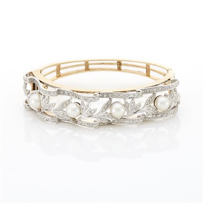 Lot 1437 - Two-Color Gold, Diamond and Cultured Pearl Bangle Bracelet