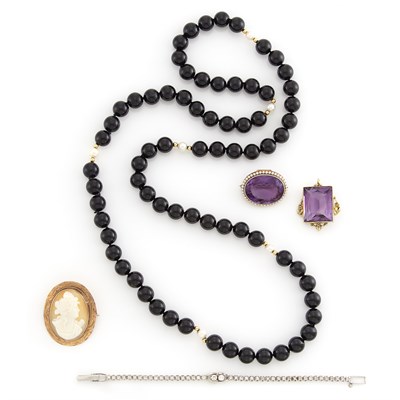 Lot 1354 - Antique Gold and Amethyst Pendant and Pendant-Pin, Cameo Brooch, White Gold and Diamond Bracelet and Black Onyx Bead Necklace