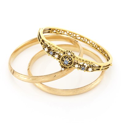 Lot 1394 - Three Gold Bangle Bracelets
