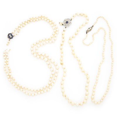 Lot 1327 - Three Pearl Necklaces with Platinum, White Gold and Diamond Clasps