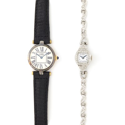 Lot 1656 - Silver-Gilt Wristwatch, Must de Cartier, and Platinum and Diamond Wristwatch