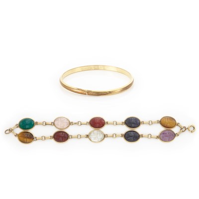 Lot 330 - Gold-Filled Bangle Bracelet and Double Strand Carved Hardstone Scarab Bracelet