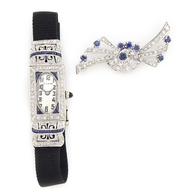 Lot 1254 - Platinum, Diamond, and Synthetic Sapphire Wristwatch and Sapphire and Diamond Brooch