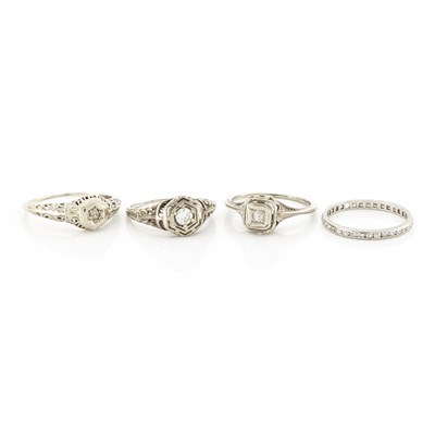 Lot 1586 - Four Platinum, White Gold and Diamond Rings