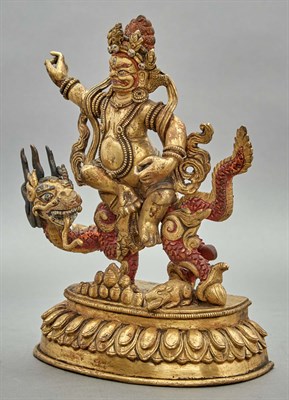 Lot 89 - Tibetan Gilt-Bronze Figure of Jambhala Seated...